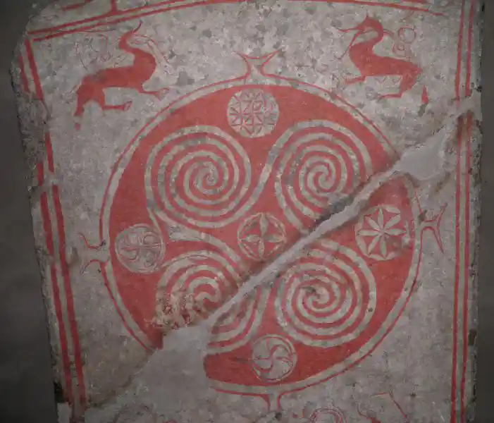 Rounded swastikas with spiral edges inside a circle